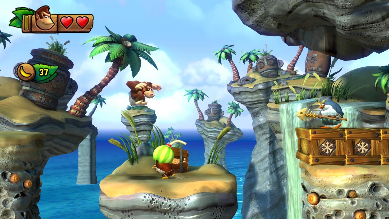 Screenshot of Donkey Kong getting ready to stomp an enemy in Donkey Kong Country: Tropical Freeze.